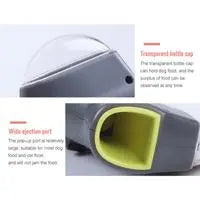 Close-up of gray pet treat launcher front with green feed chute
